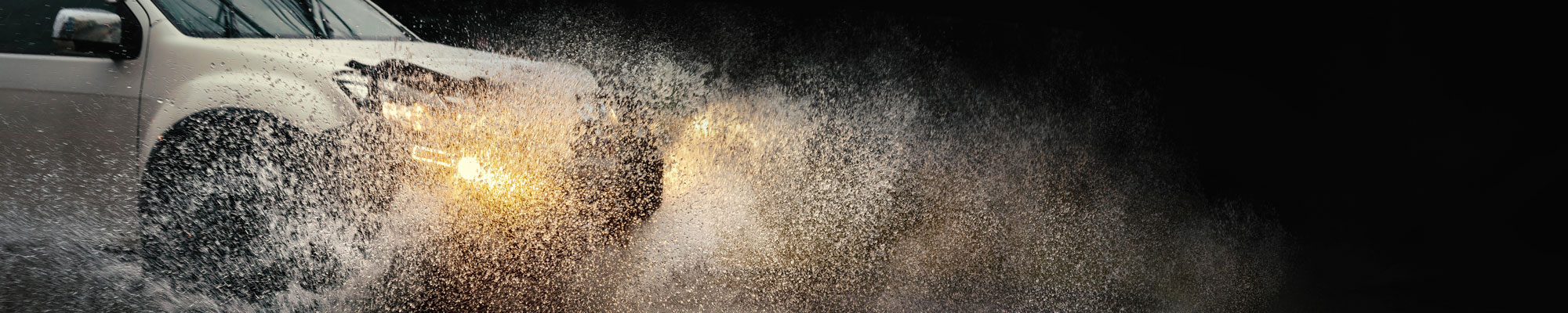Vehicle driving through flood water in North Wales